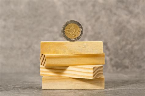 Two Euros Coin Balancing on a Wooden Blocks Tower Stock Image - Image of banking, office: 270939335