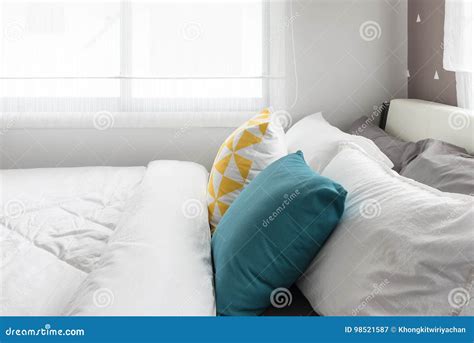 Colorful Pillows on White Bed in Modern Bedroom Stock Image - Image of ...