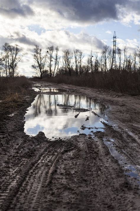 Mud And Puddles On The Dirt Road Stock Image - Image of empty, puddle ...