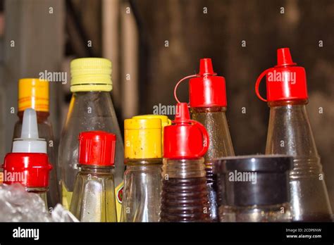 Plastic sauce bottles with colorful caps Stock Photo - Alamy