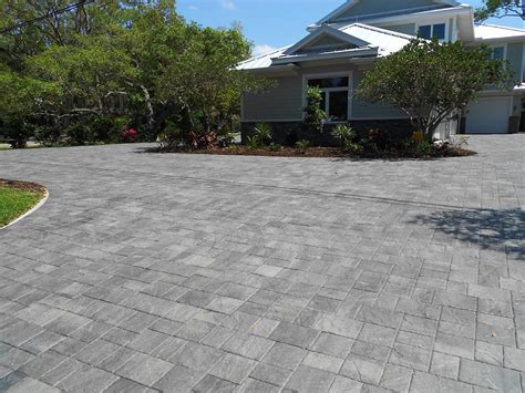 Stonehurst Granite paver driveway installed in a random pattern by ...