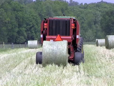 Round Hay Baler In Operation Stock Footage Video 168730 - Shutterstock