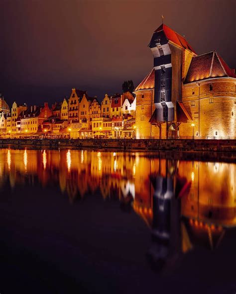 Turns out Gdansk by night is stunning, the lights reflecting on the water and the old quirky ...