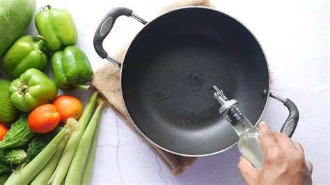 a person is pouring cooking oil on a frying pan 26519669 Stock Video at ...