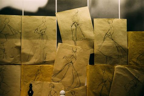 Paper sheets with sketches of historical dresses · Free Stock Photo