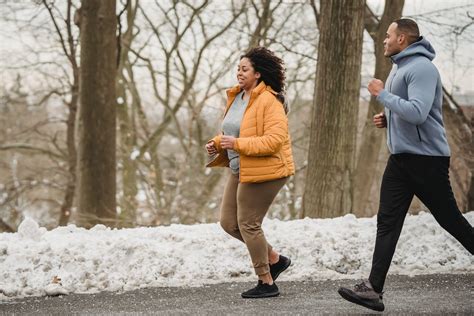 Sporty black woman running with instructor on street · Free Stock Photo