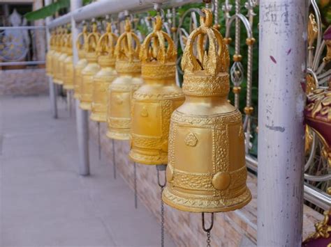 Premium Photo | Golden bells around the church the sound of chimes in a thai temple