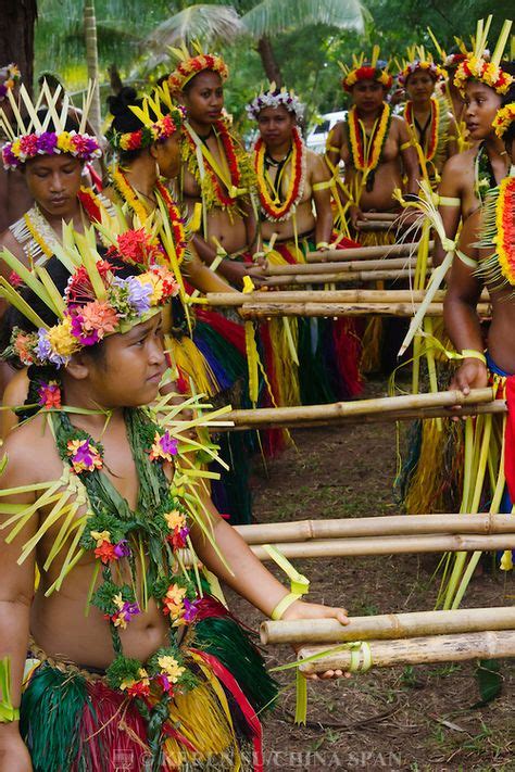 Yapese girls in traditional clothing dancing with bamboo pole at Yap Day Festival, Yap Island ...