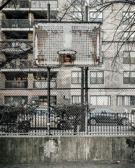 an old basketball hoop in front of a building