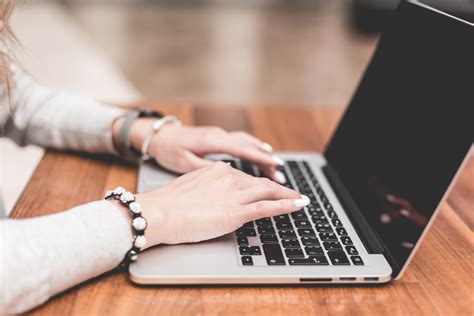 Young Woman Working/Typing on Her Laptop Free Stock Photo Download | picjumbo