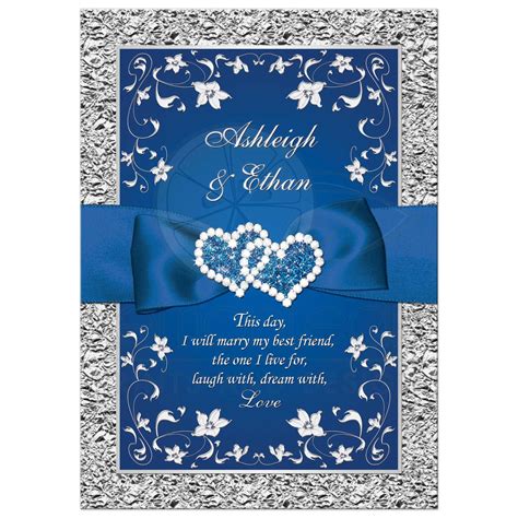 Royal blue and silver grey floral wedding invitation with joined jewel hearts and ribbon.