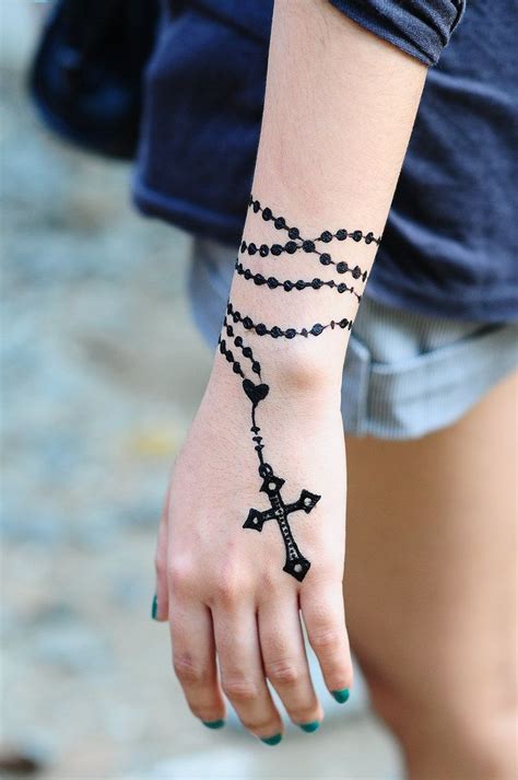 Cross | Wrist tattoos, Rosary tattoo on hand, Wrist tattoos girls