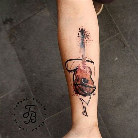 10 Guitar Tattoos That Rock | Music tattoo designs, Guitar tattoo design, Geometric tattoo guitar