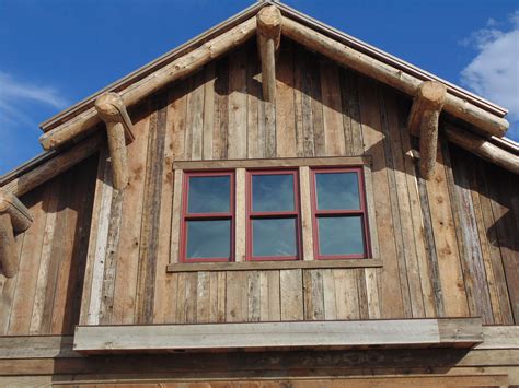 Rustic Wood Hub's reclaimed barn siding adorns this gable. | Barn ...