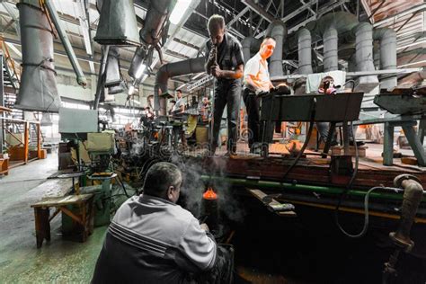 Minsk, Belarus - February 01, 2018: Glass Factory Workers on Production of Glass Background ...