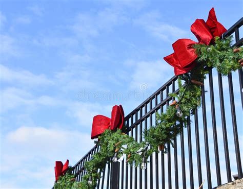 Pine Bough and Red Bows on Wrought Iron Fence 2 Stock Photo - Image of pine, textured: 271907762