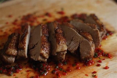 Sliced cooked duck sitting on red chillies, mint, honey an… | Flickr