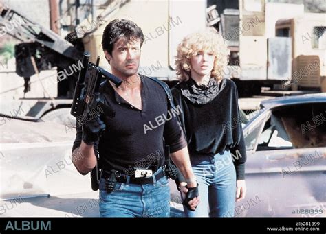 BRIGITTE NIELSEN and SYLVESTER STALLONE in COBRA, 1986, directed by GEORGE P. COSMATOS ...