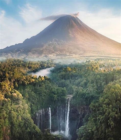 🔥 Tumpak Sewu waterfall located In East Java, Indonesia! It’s overshadowed by Semeru, an active ...