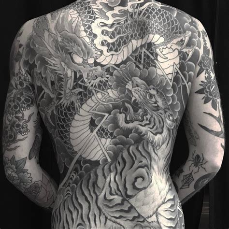 Dragon versus Tiger tattoo by Chris Garver #ChrisGarver #Japanesetattoos #blackandgrey #dragon # ...