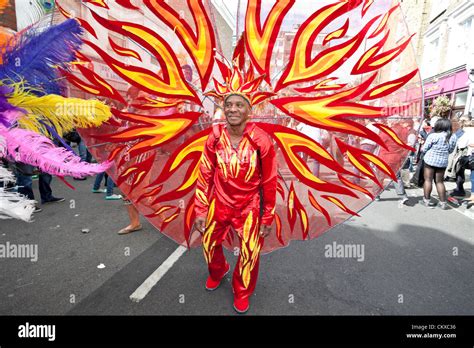 Notting Hill Carnival senior dancer wears a colourful costume Stock ...