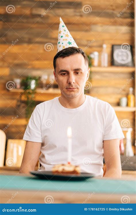 Sad Lonely Young Man Celebrating Birthday Alone, Sitting at the ...