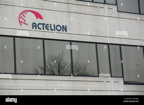 A logo sign outside of a facility occupied by Actelion Pharmaceuticals ...