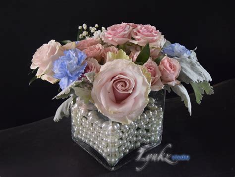 Centerpiece in square vase with pearls with blue carnations and blush roses Blue Carnations ...