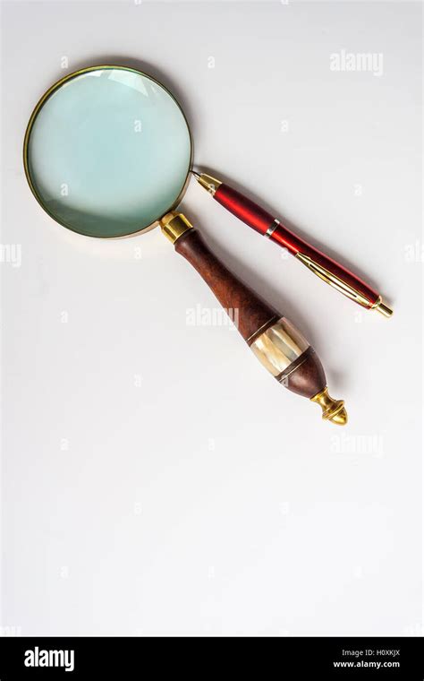 Ballpoint Pen and Magnifier Stock Photo - Alamy