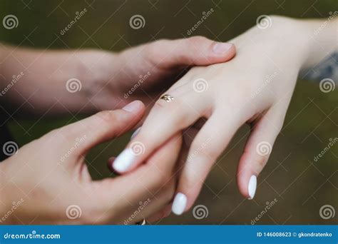 Groom Puts the Ring on the Finger of the Bride. Hands of Groom and Bride with Rings Stock Image ...