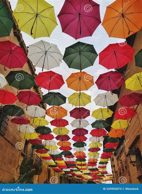 Colorful Umbrellas Hanging Across a Typical Street in the City Center ...