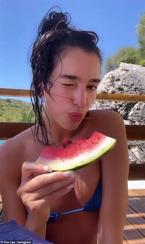 Makeup-free Dua Lipa wears a blue bikini as she films herself eating a ...