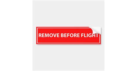 Remove before flight bumper sticker | Zazzle