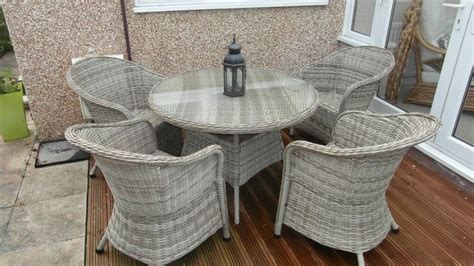 Rattan round garden table and 4 chairs | in Llandudno, Conwy | Gumtree