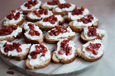 Roasted Tomato Crostini with Basil Pesto - Pretty in Pistachio