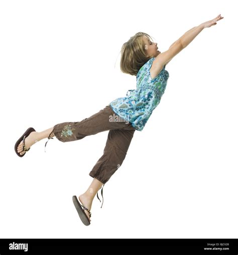 Young girl flying through the air Stock Photo - Alamy