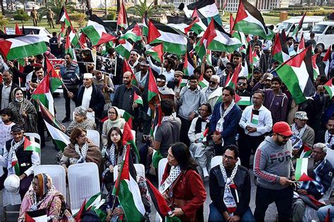 Activists of Civil Society holding Palestine Flags and placards during a protest demonstration ...