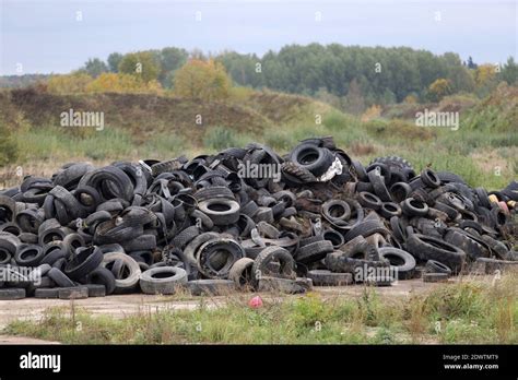 Old tyres polluting the nature. Lithuania. Kedainiai Stock Photo - Alamy