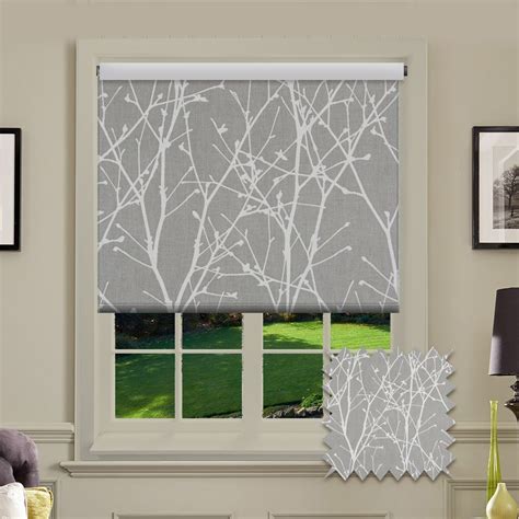 A patterned roller blind in grey with white tree fabric design This ...