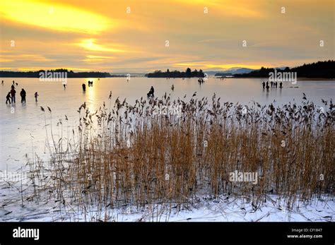 Lake of Menteith in the winter covered in 6 inches of ice with an informal Bonspiel taking place ...