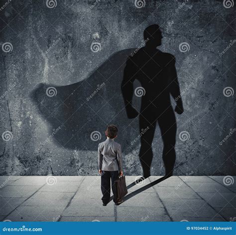 Young Businessman with His Shadow of Super Hero on the Wall. Concept of ...
