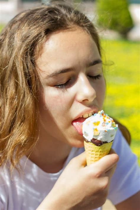 Beautiful Teen Girl Eating Ice Cream in a Waffle Cone in Summer ...