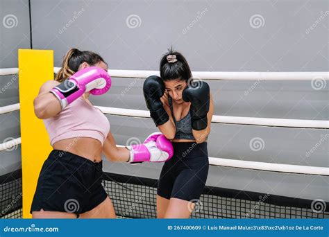 Female Boxer Punching Her Practice Opponent in the Stomach from the ...