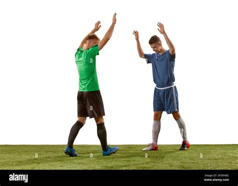 Salutation. Rival soccer players wearing blue and green football kits ...