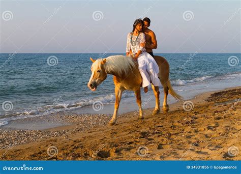 Attractive Couple in Love Riding Horse on the Beach. Stock Photo ...