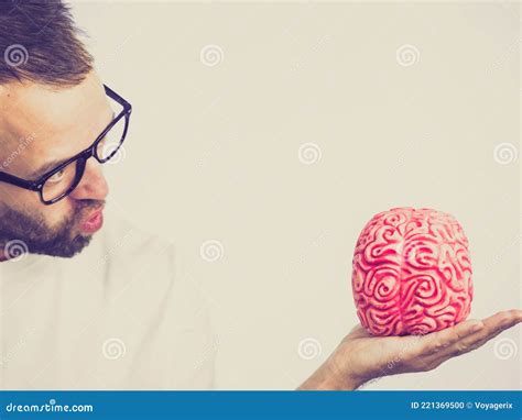Man looking at human brain stock photo. Image of looking - 221369500