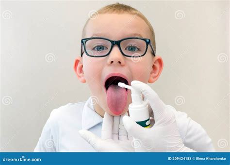 Funny Boy with Sore Throat Wearing Glasses, Doctor Uses Medicine ...