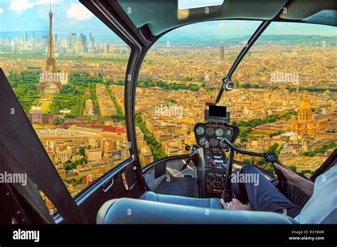 Helicopter cockpit flying on Panorama of Tour Eiffel and national ...