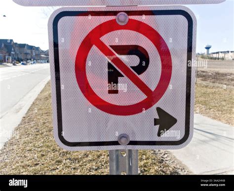 Clearly marked no parking sign alerts drivers to keep the street clear ...
