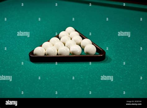 gambling table with russian billiard set and cue balls close-up ...